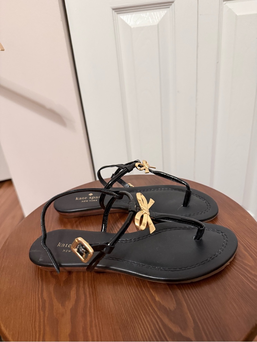 kate spade Black Sandals with Gold Bow Accents